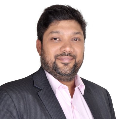 Profile image of a man in a business suit with a white background.